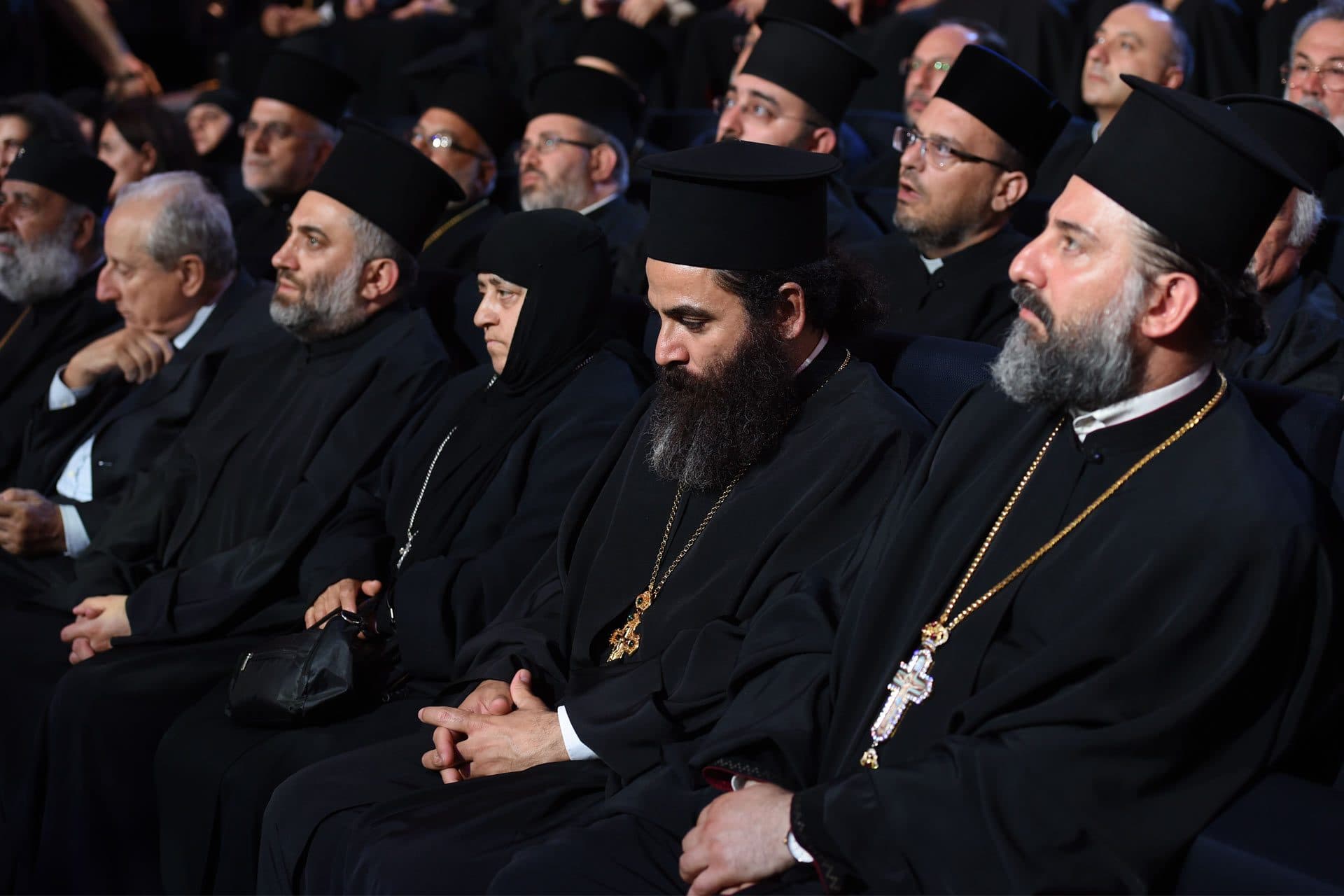 Clergy in the front rows of the audience