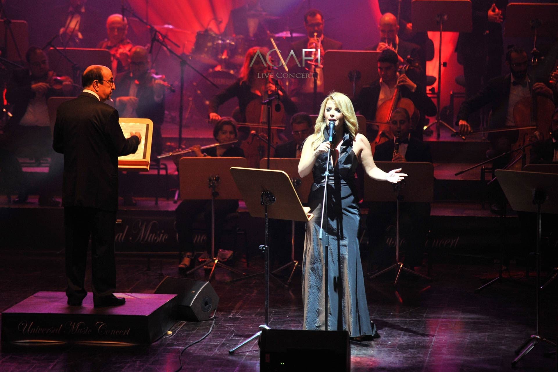 A soprano singing in red light