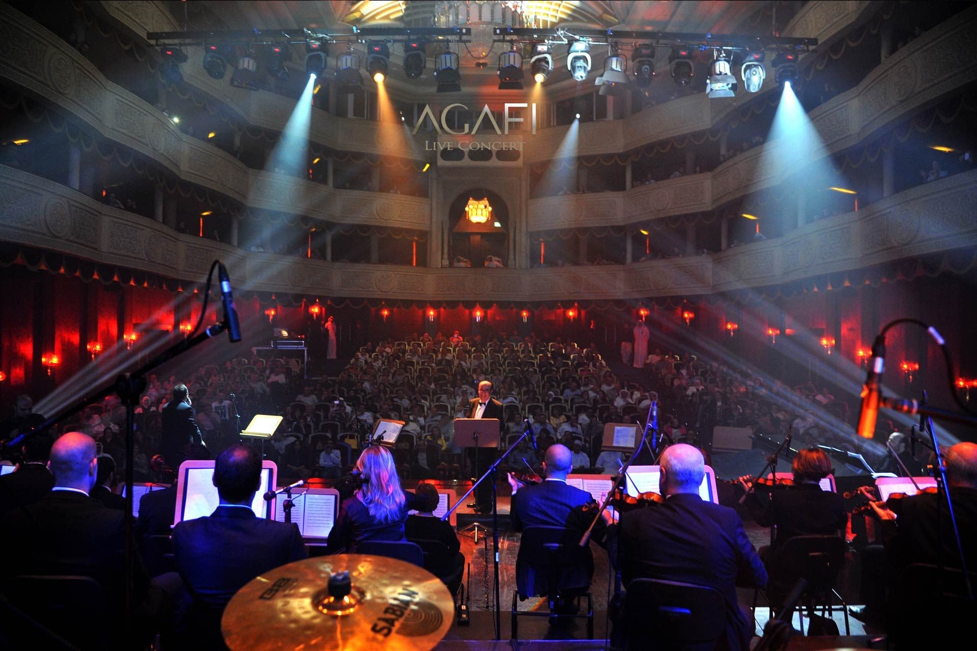 The full hall seen from behind the orchestra