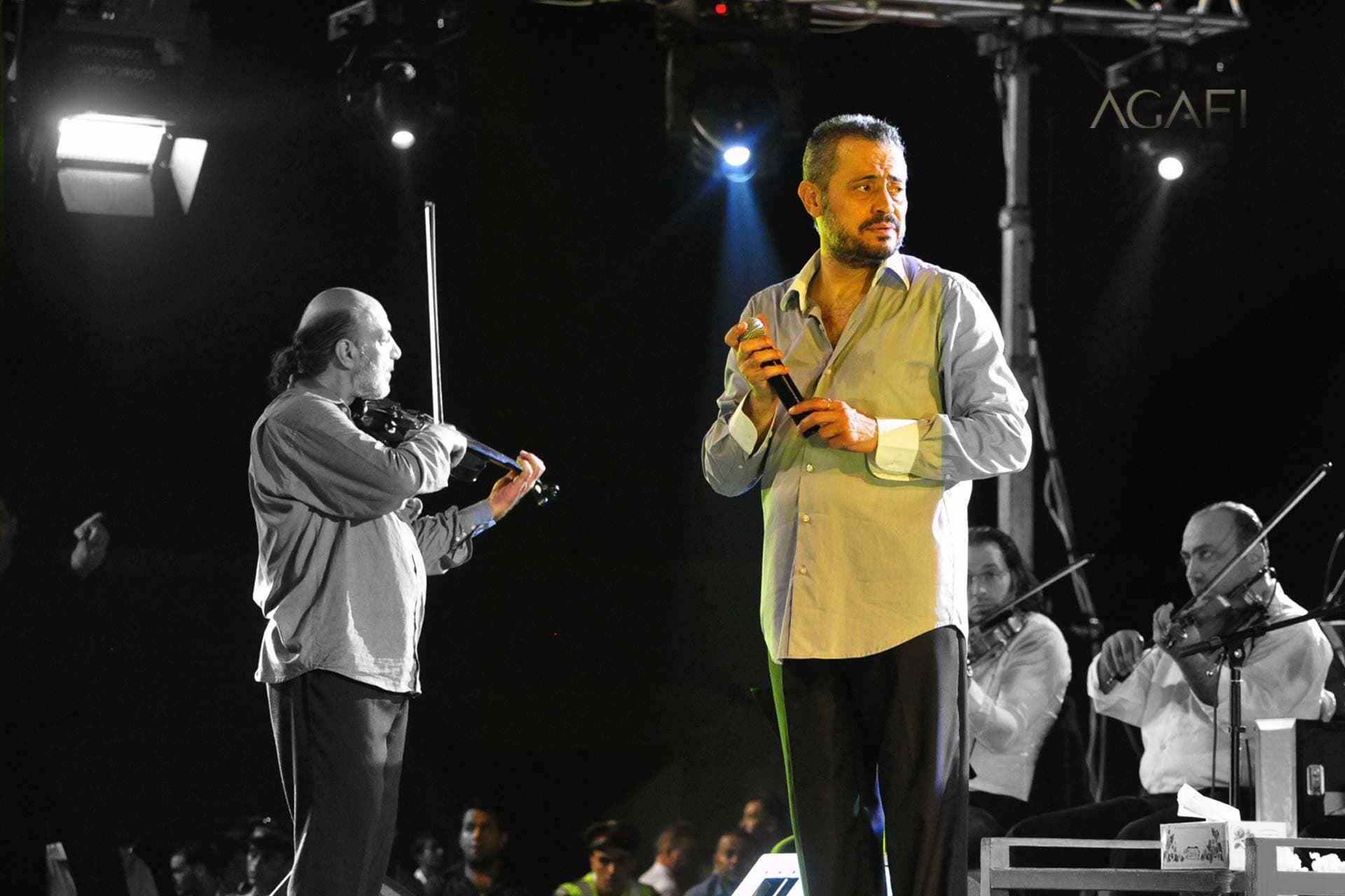 George Wassouf on stage beside his violinist