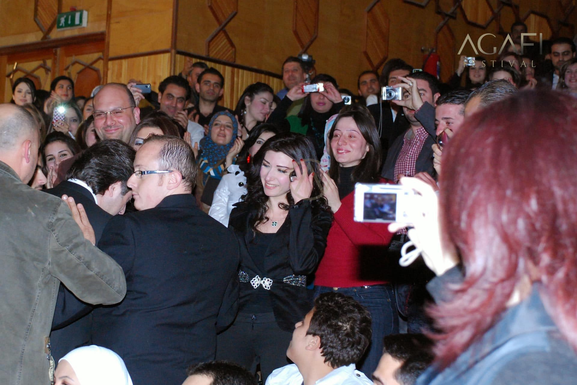 Fans taking photos of the singer