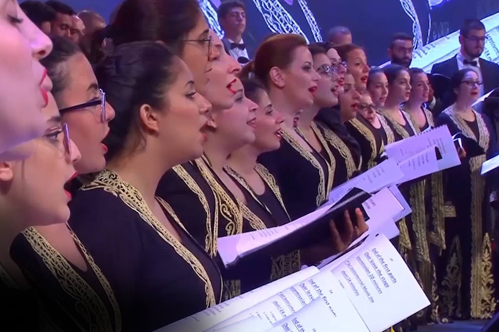 Women of the choir singing from their scores