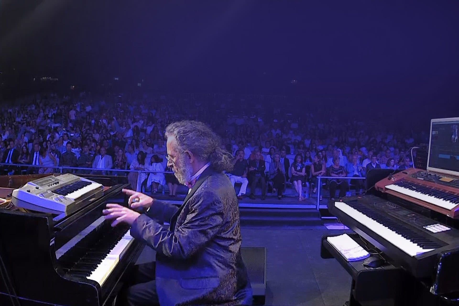 Jamal Abu Hosn at the piano, with the audience behind him