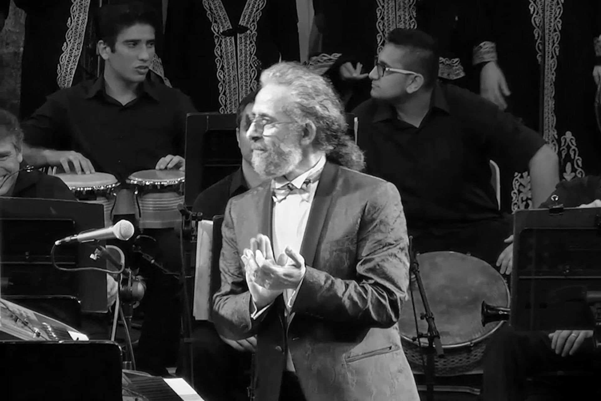 Jamal Abu Hosn applauding the musicians