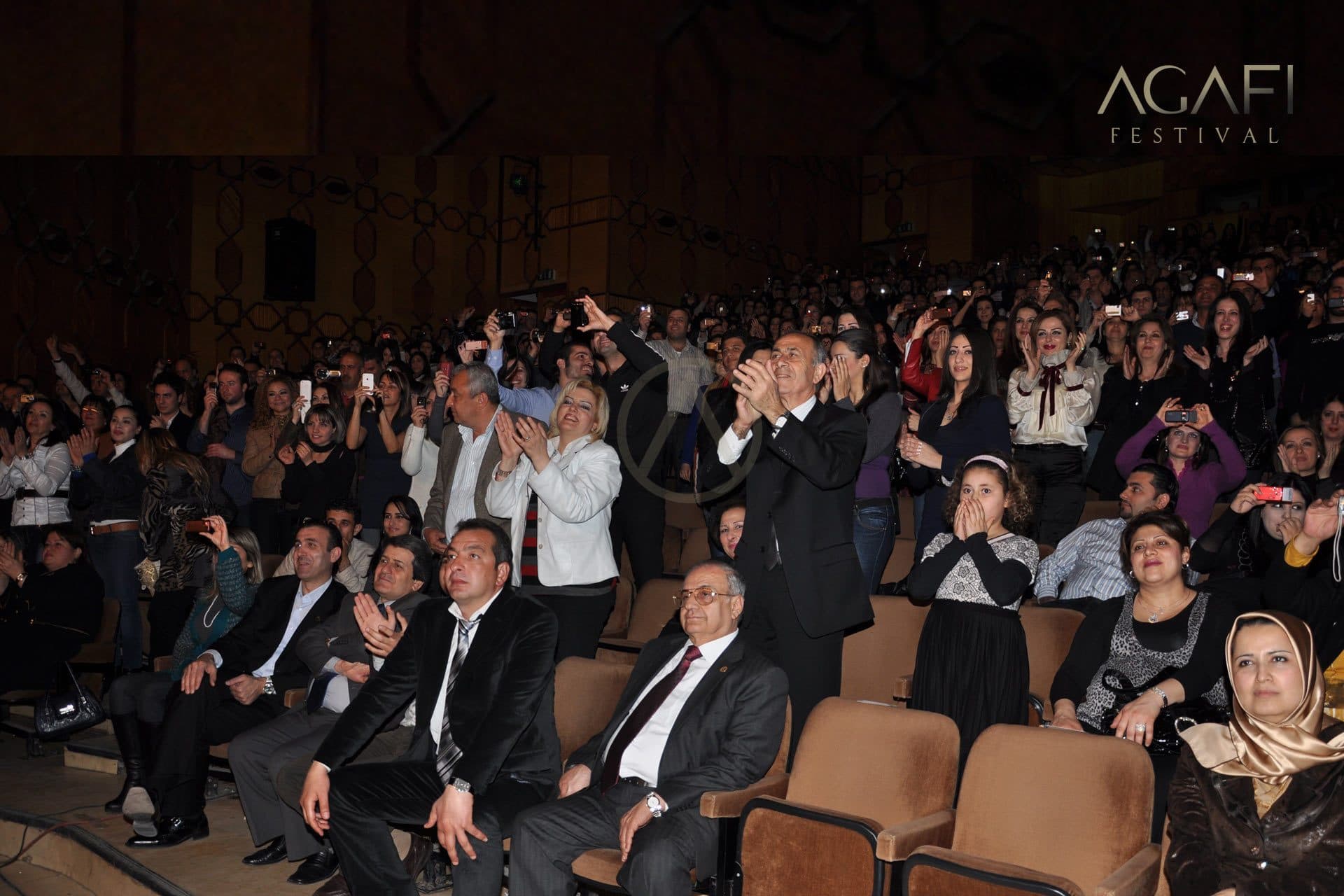 The audience applauding from their seats