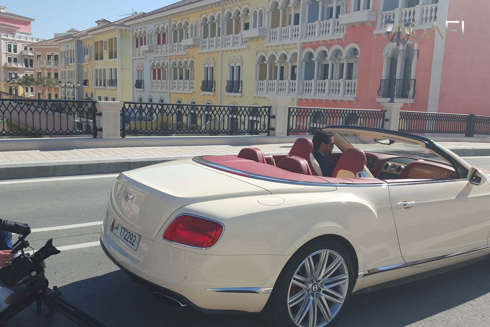 Filming a Bentley convertible on a waterfront street