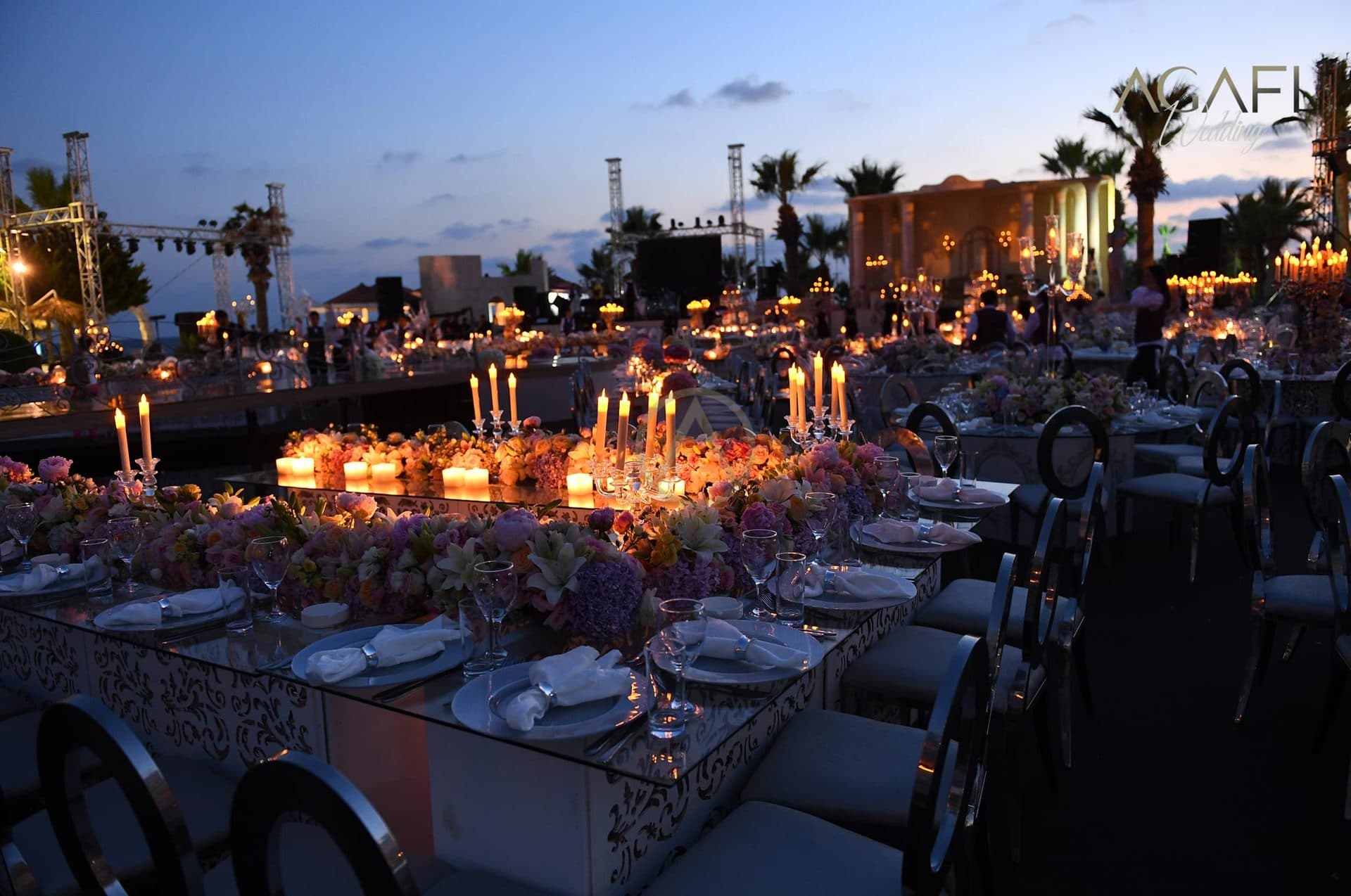 The banquet glowing at dusk by the sea