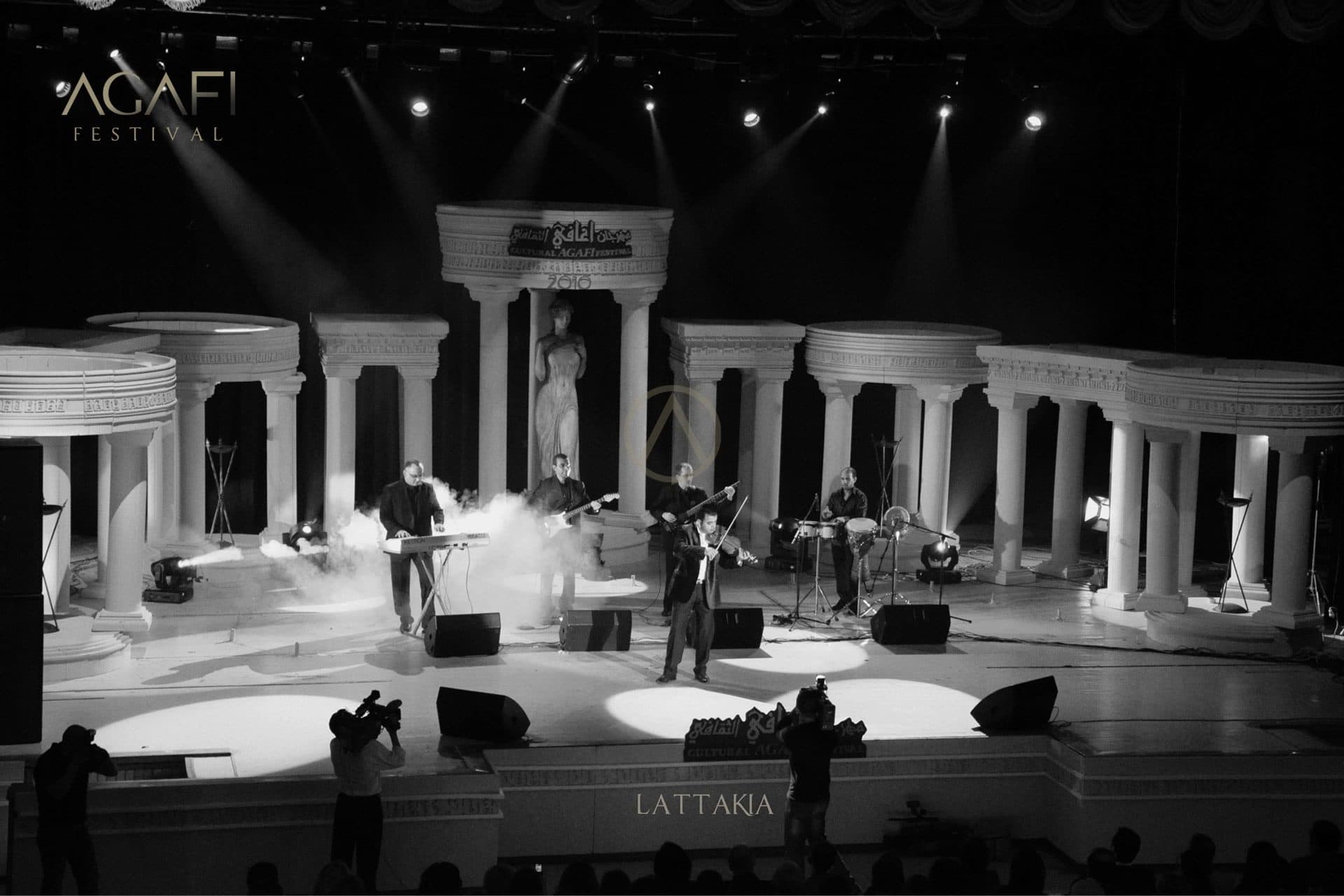 A stage built as a classical colonnade, in black and white