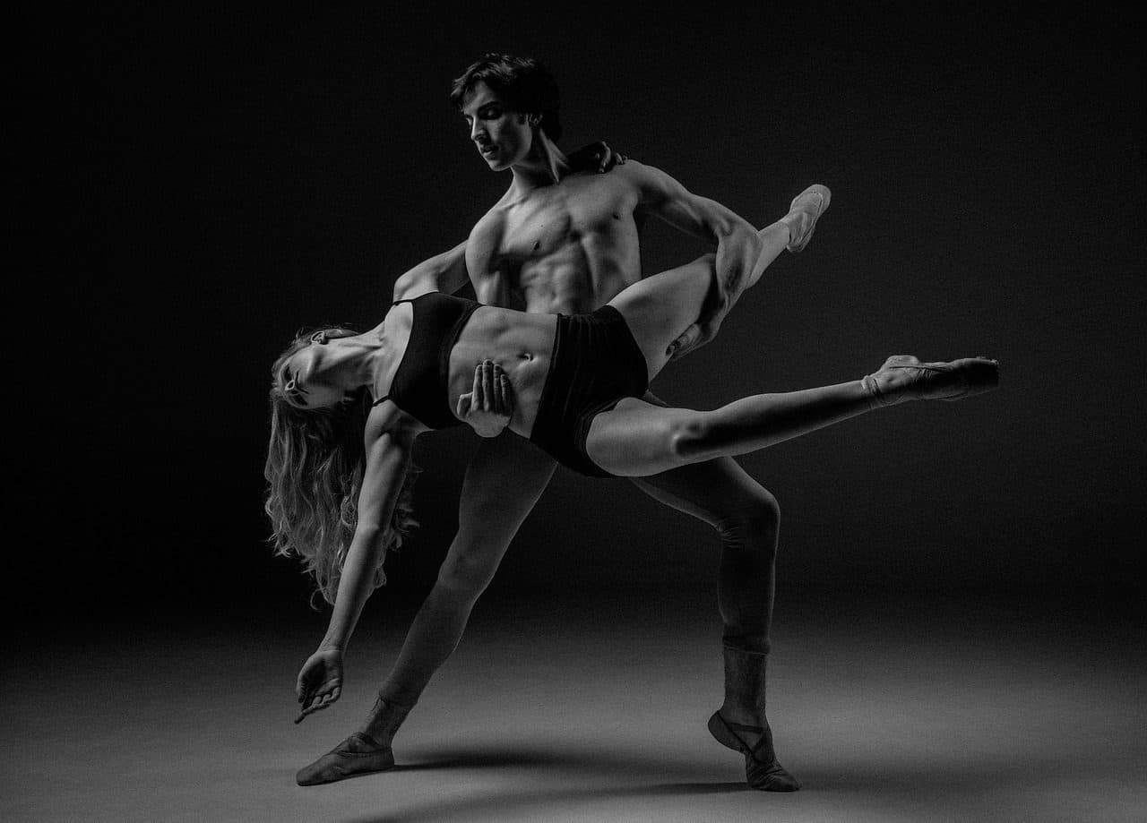 Two dancers in a lift, in black and white